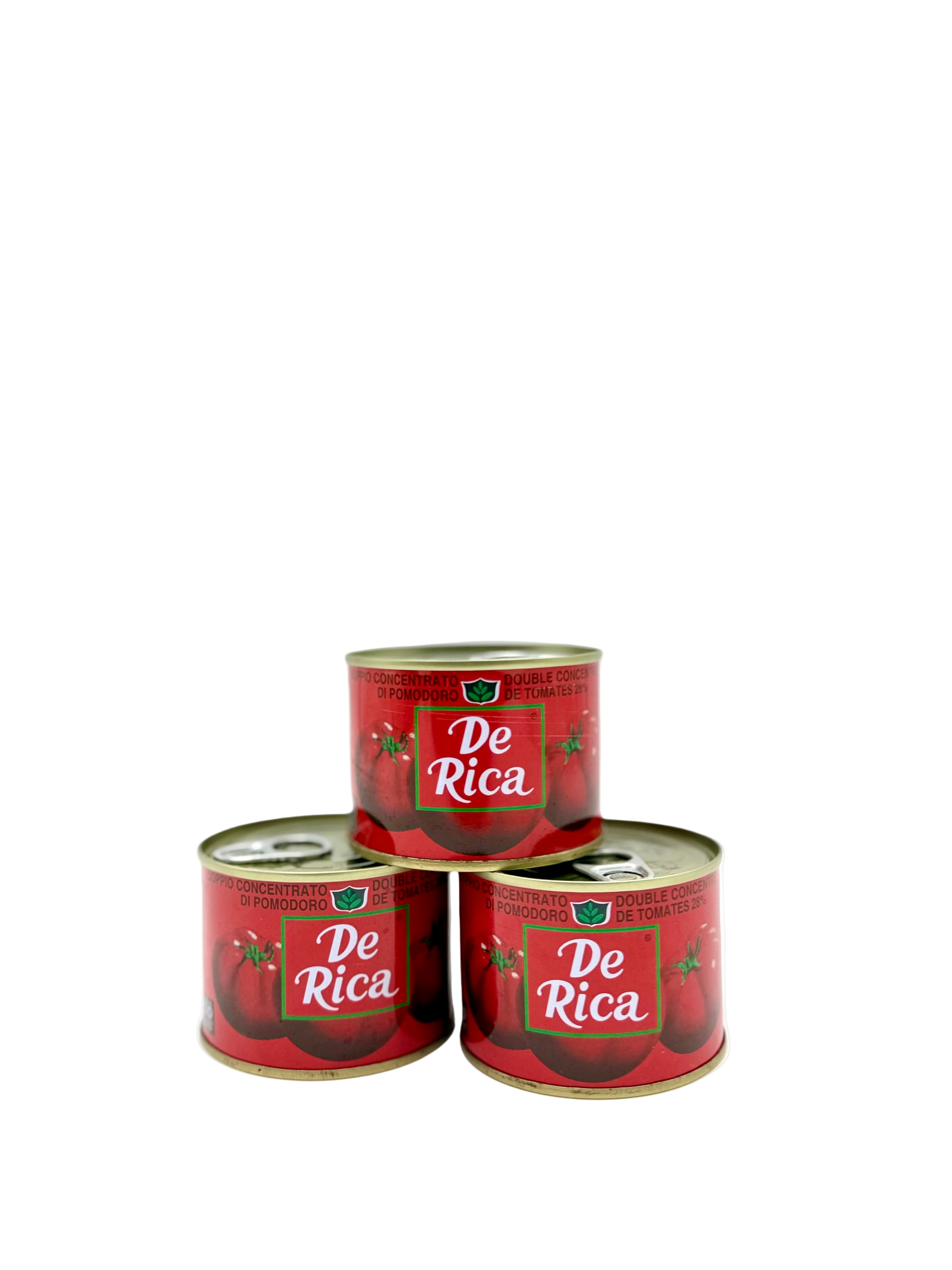 Three cans of De Rica on a white background