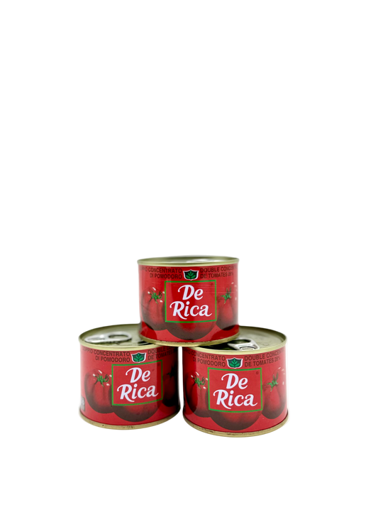 Three cans of De Rica on a white background