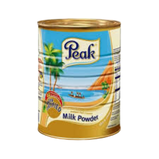 Can of Peak milk powder with a scenic label on a white background