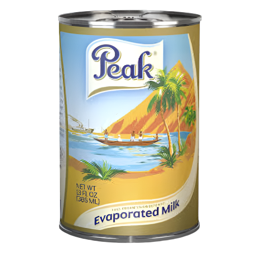 Can of Peak evaporated milk with a scenic label on a white background