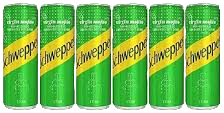 Multiple green and yellow Schweppes cans arranged in a grid pattern.